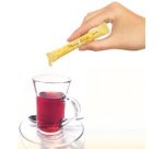 Stick de miel, dans un présentoir en carton