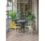 Mesa redonda Tella terrazo negro y patas de acero Ø 70 cm